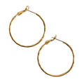 Gold-plated 3 cm hoop earrings, elegant and versatile for any occasion.