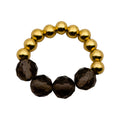 Gold and smoky quartz semi-precious stone ring Bo with stretch band, handcrafted design.