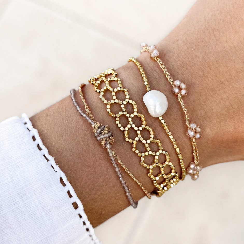 Elegant Peggy Queen adjustable bracelet with 14k gold-plated beads and freshwater pearl.