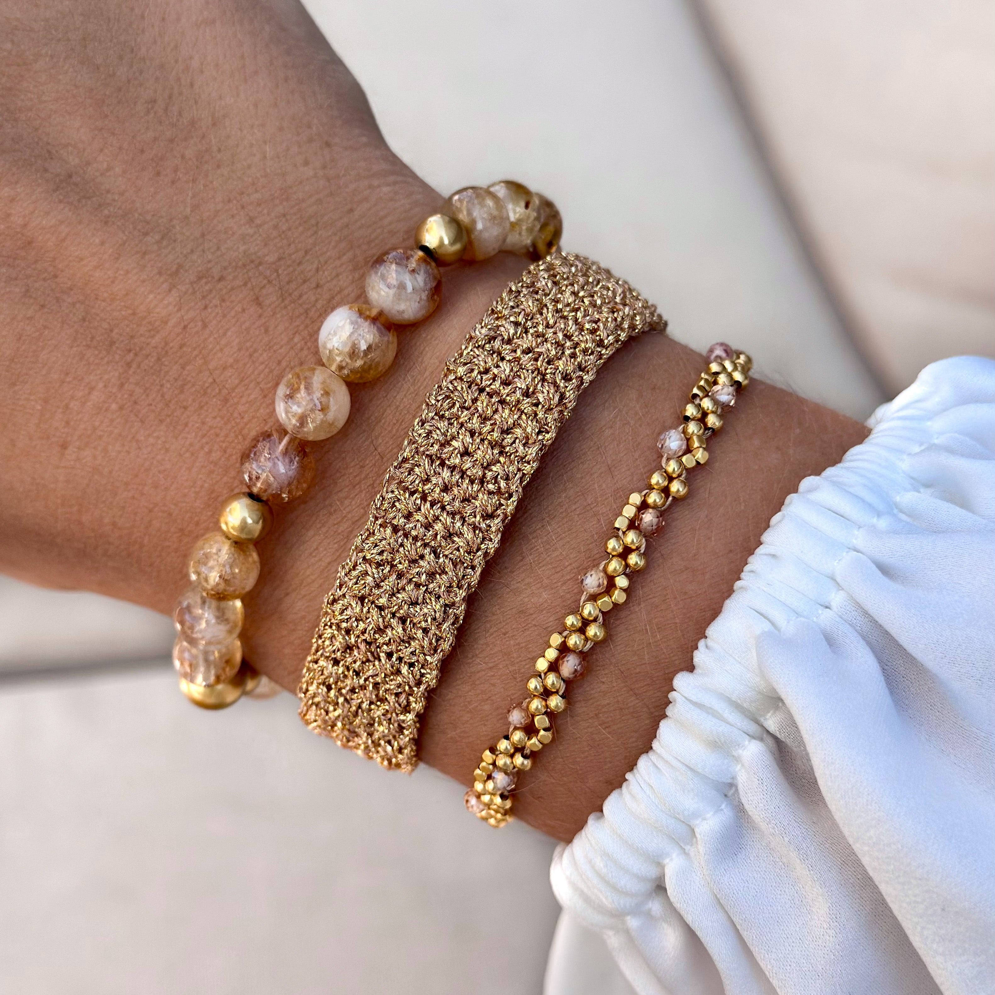 Bold handmade bracelet cuff with gold beads and a semi-precious accent.