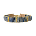Close-up of elegant bracelet made from semi-precious stones and artisanal details.