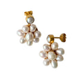 Gold-plated flower pearl stud earrings with genuine freshwater pearls, elegant floral design for weddings or daily wear.
