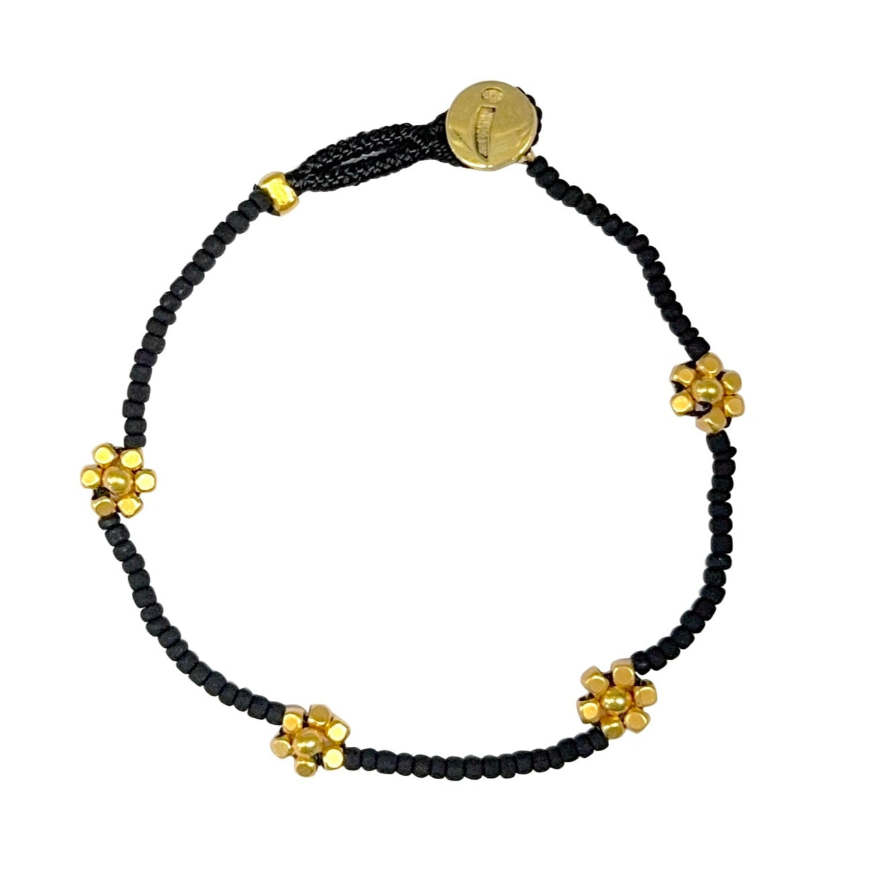 Feminine beaded bracelet with gold-toned floral details.