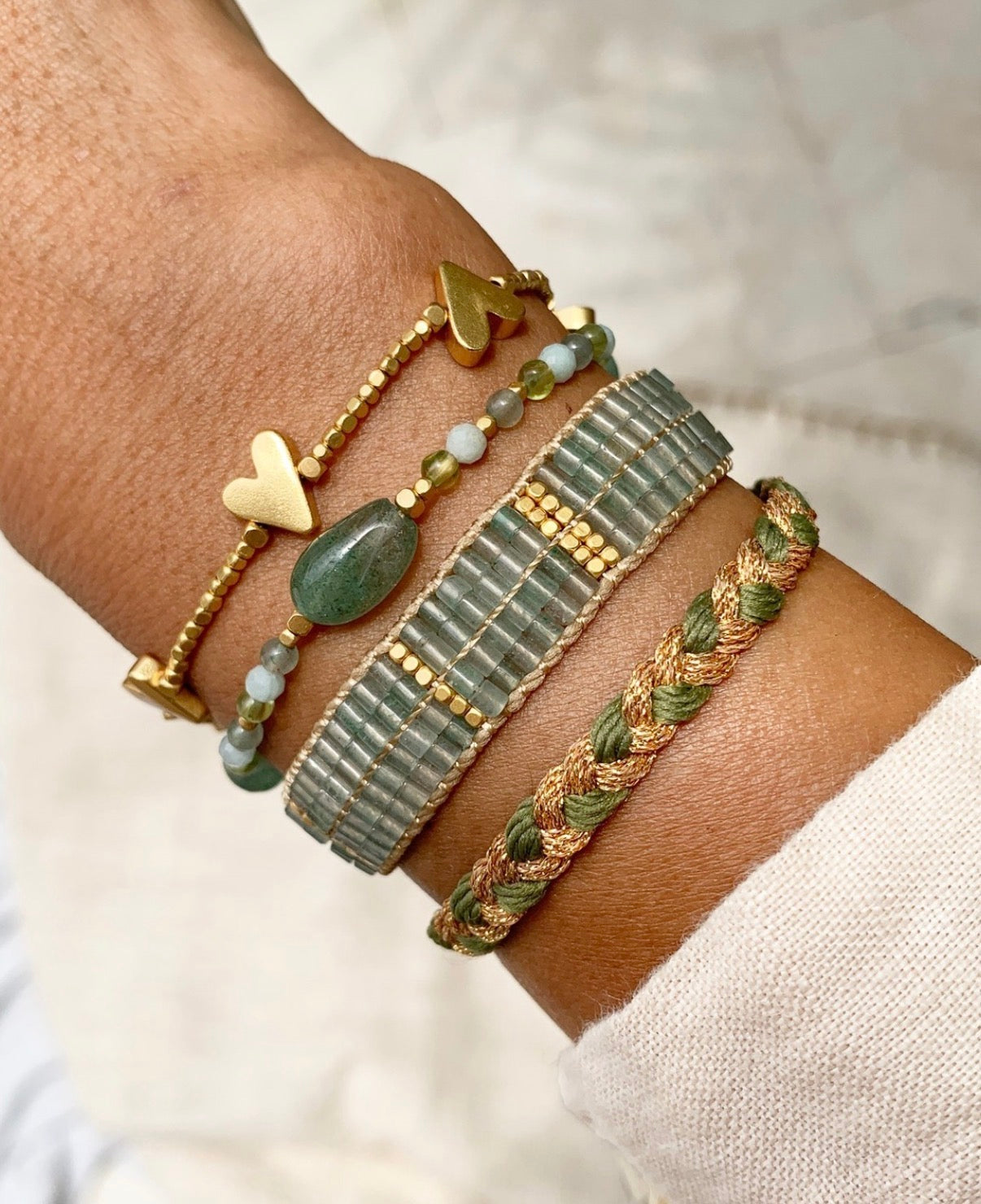 Handmade PEGGY 4 Heart Bracelet with gold-plated beads and heart charms, adjustable size, vintage-inspired.