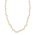 Gold-plated Rey necklace with bead accents and adjustable closure, versatile for versatile for both day and evening wear.