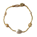 Peggy Pearl Flower Bracelet with freshwater pearls, 14K gold-plated beads, and adjustable gold clasp.