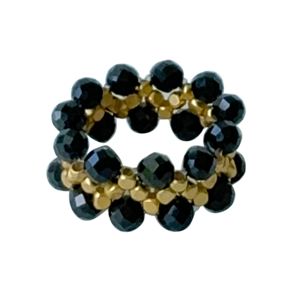 Handcrafted Ziggy ring featuring pink semi-precious stones and gold beads, perfect for stylish stacking.