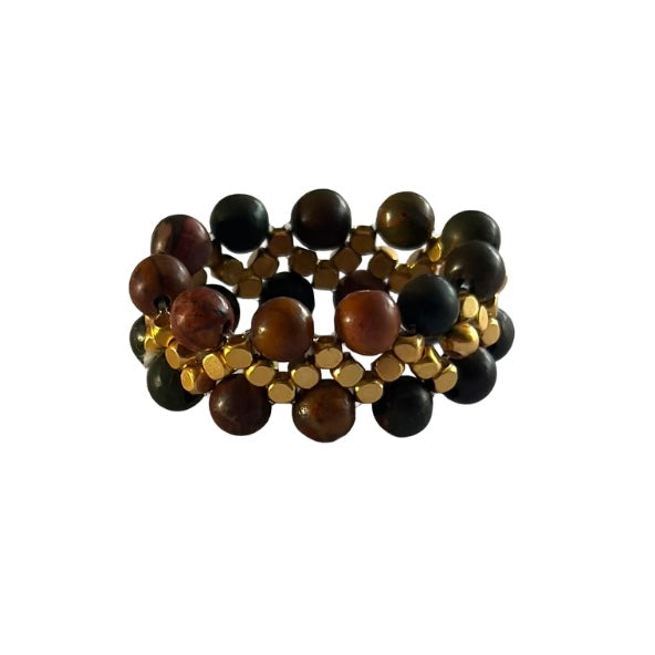 Handcrafted Ziggy ring featuring pink semi-precious stones and gold beads, perfect for stylish stacking.